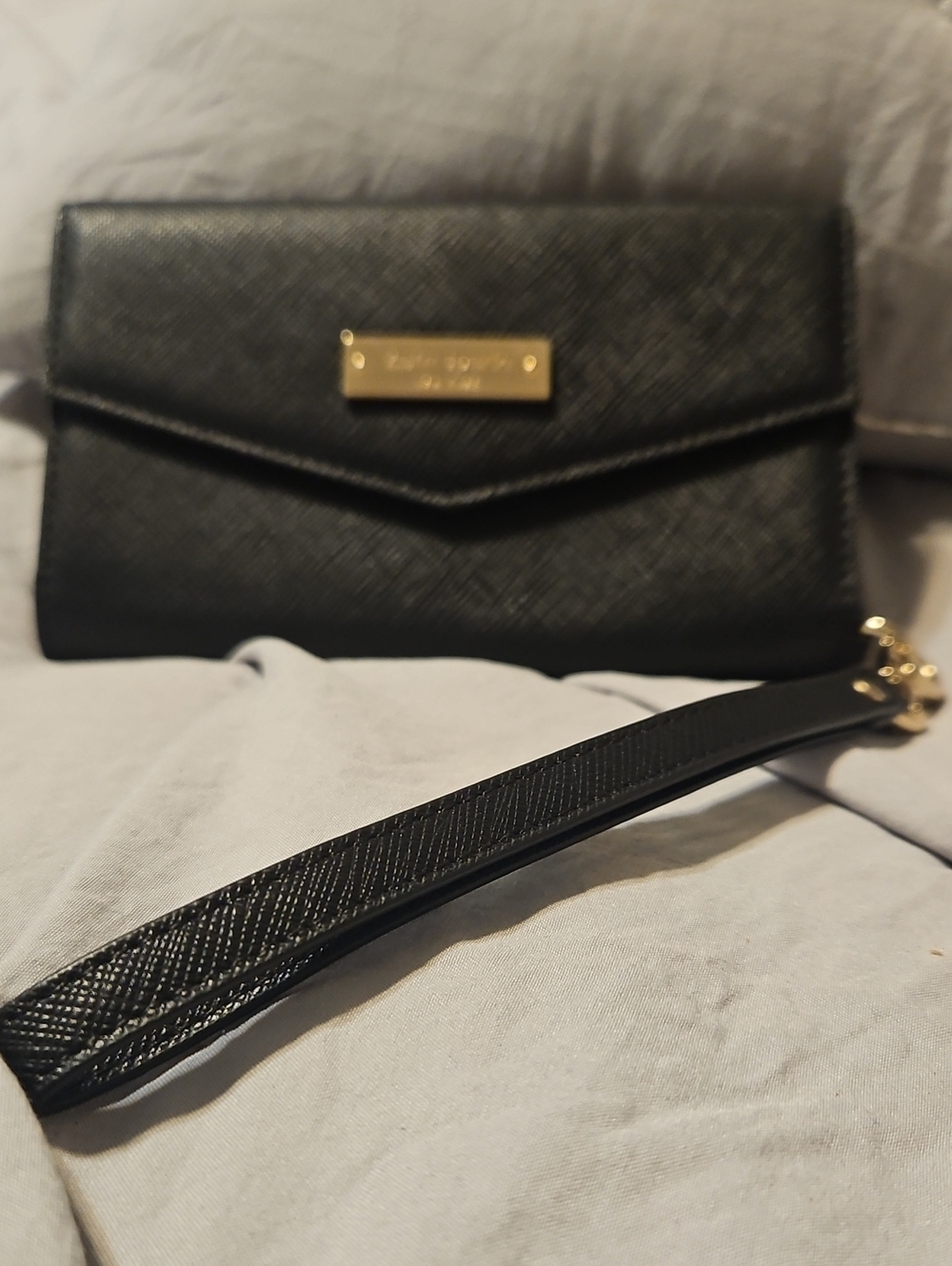 kate spade black saffiano wristlet clutch with gold-tone plaque